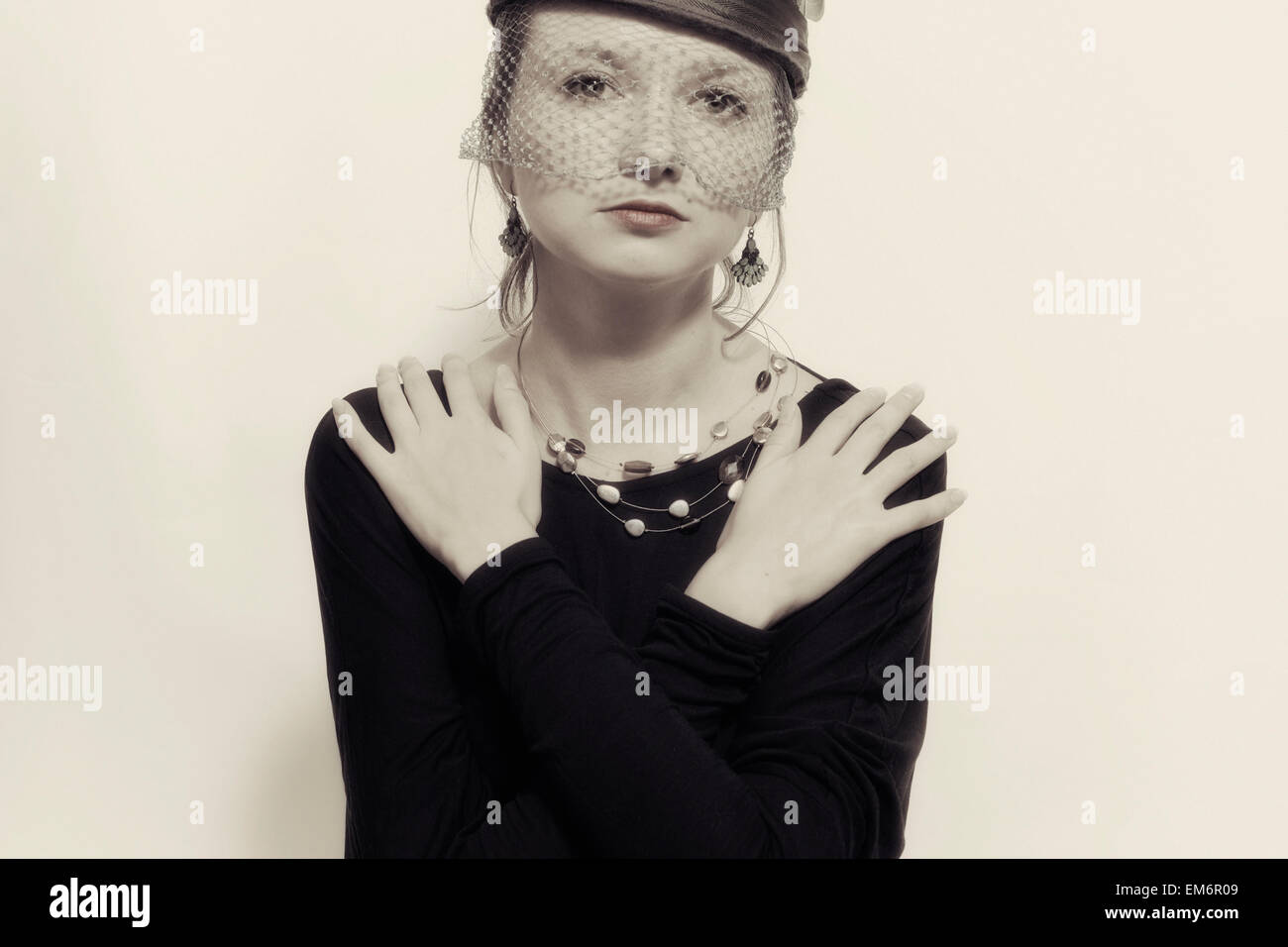 Young beautiful woman in the veil on a light background Stock Photo - Alamy