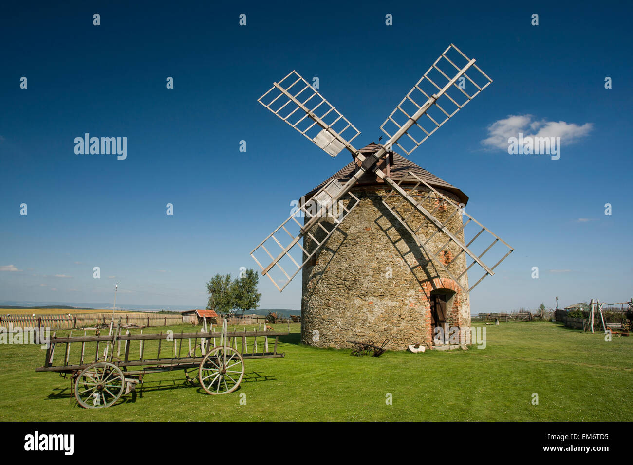 An old wind mill near the town of Vilemov in eastern Czech Republic. The mill is a fully operational flour mill. Stock Photo