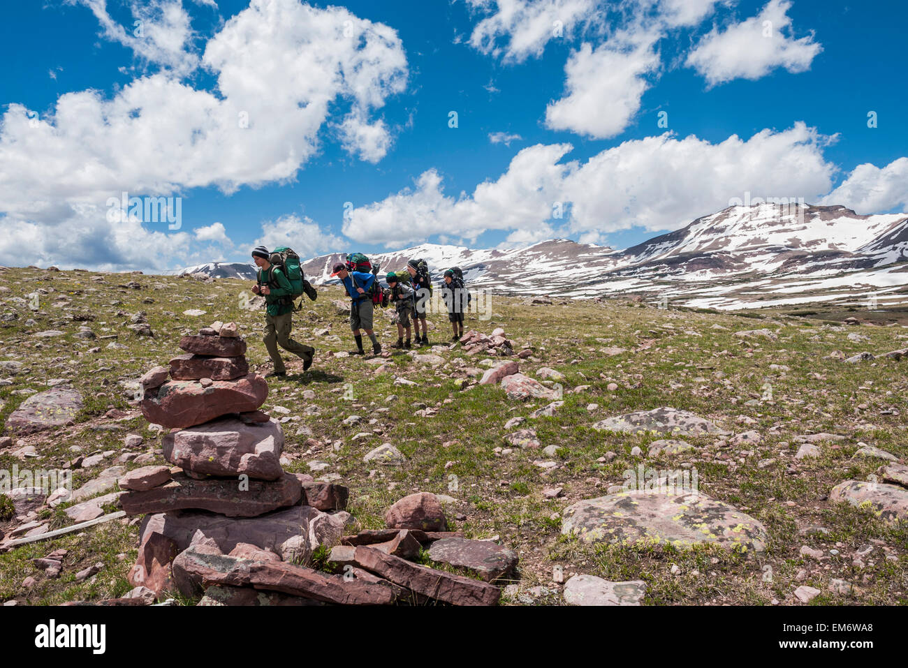 Boys backpack up and over Tungsten Pass  during a six day trip through the High Uintas Wilderness Area, Uintas Range, Utah Stock Photo