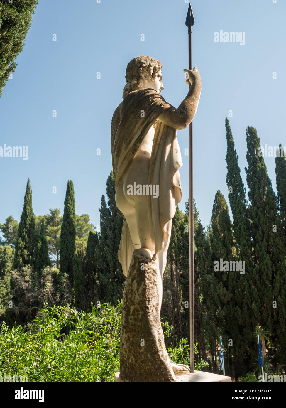 Classical statue and cypresses trees in Achillion Palace garden Stock Photo