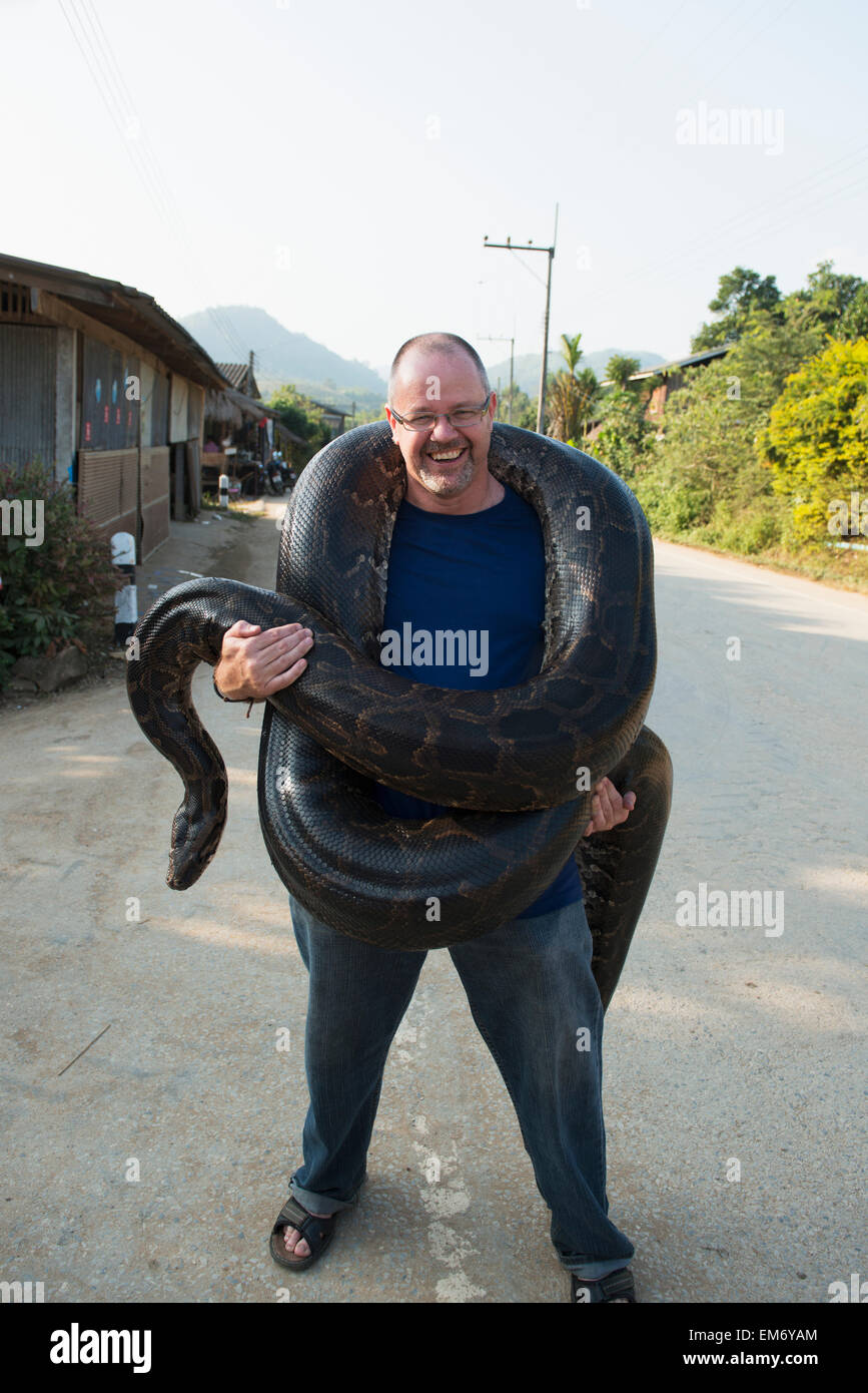 Man holding a python; Thaton, Chiang Rai, Thailand Stock Photo - Alamy