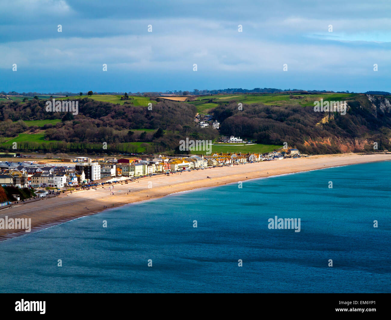 A view from the cliffs along the South West Coastal Path looking down on to the beach and seafront at Seaton Devon England UK Stock Photo