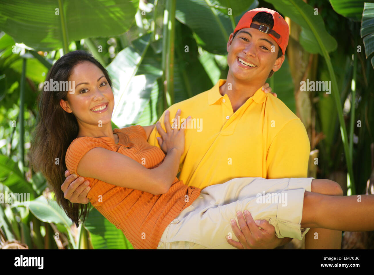Cute Local Couple, Guy Cradling Girl In His Arms Stock Photo Alamy