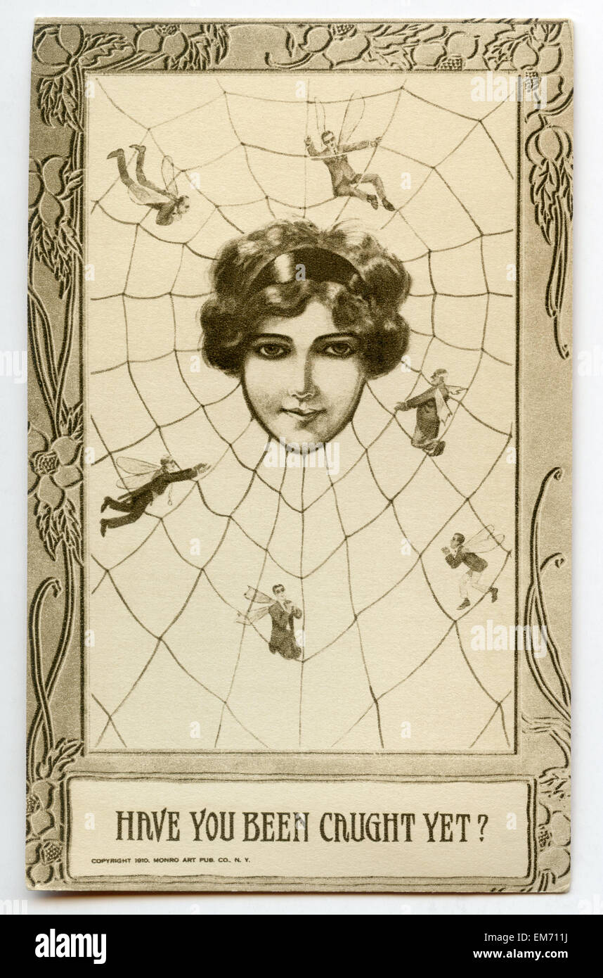 Vintage postcard depicting a woman catching men in her web Stock Photo