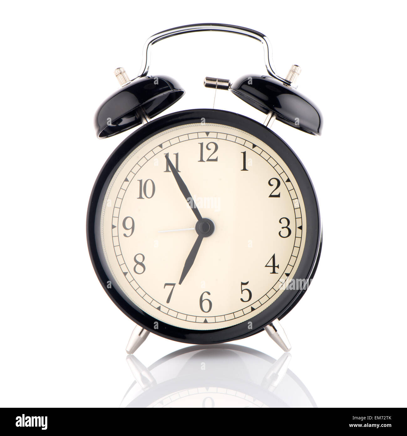 Old fashioned alarm clock on white background Stock Photo - Alamy