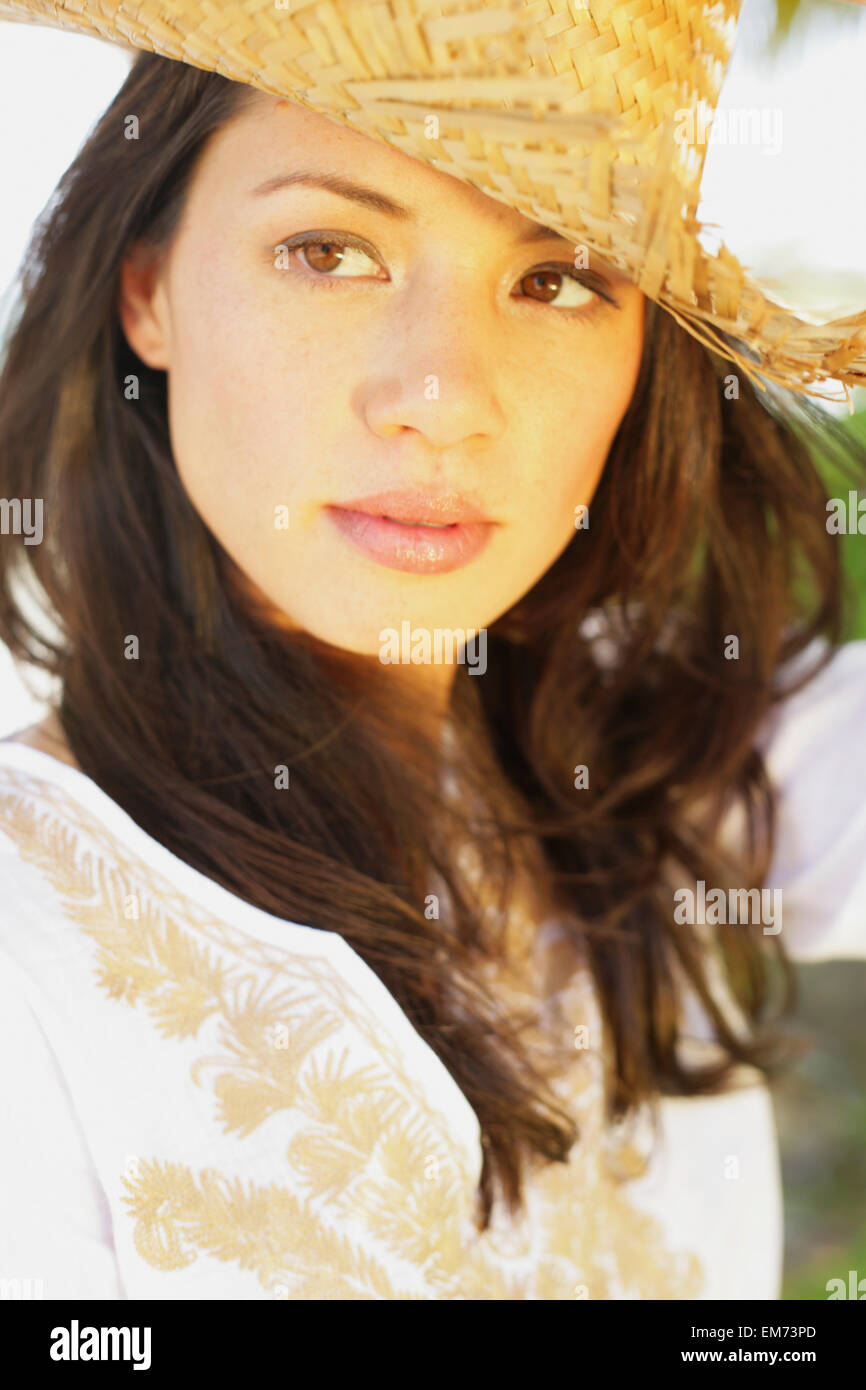 Beautiful Young Woman Wearing A Straw Hat Stock Photo - Alamy