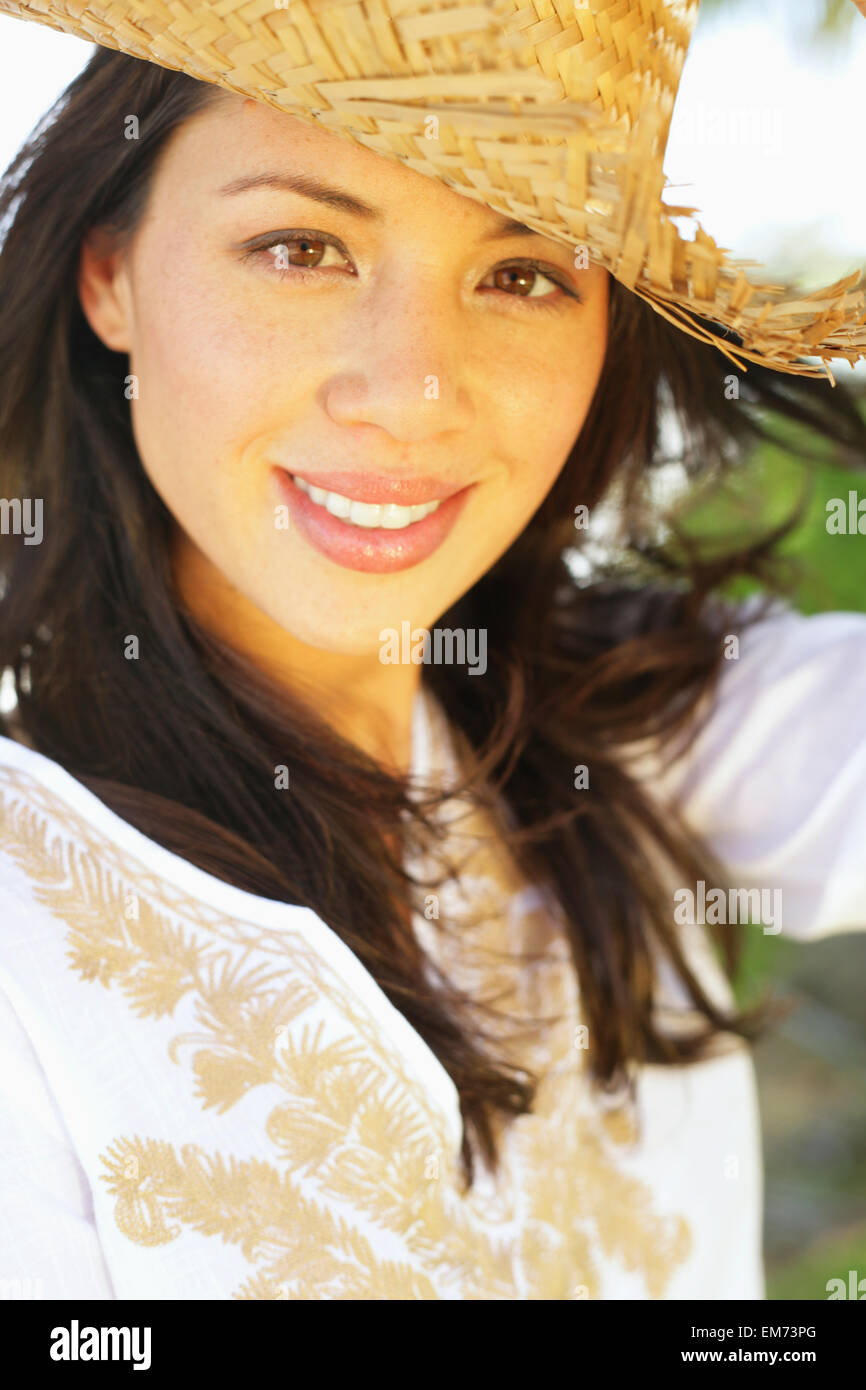 Beautiful Young Woman Wearing A Straw Hat Stock Photo - Alamy