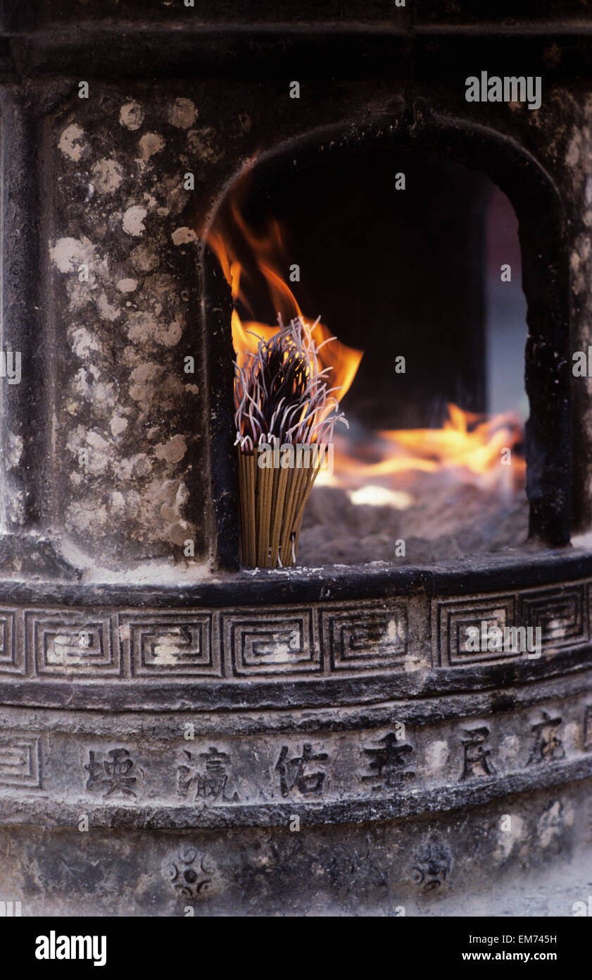 China, Tianjin, Fireplace with burning incense sticks; Culture street Stock Photo Alamy