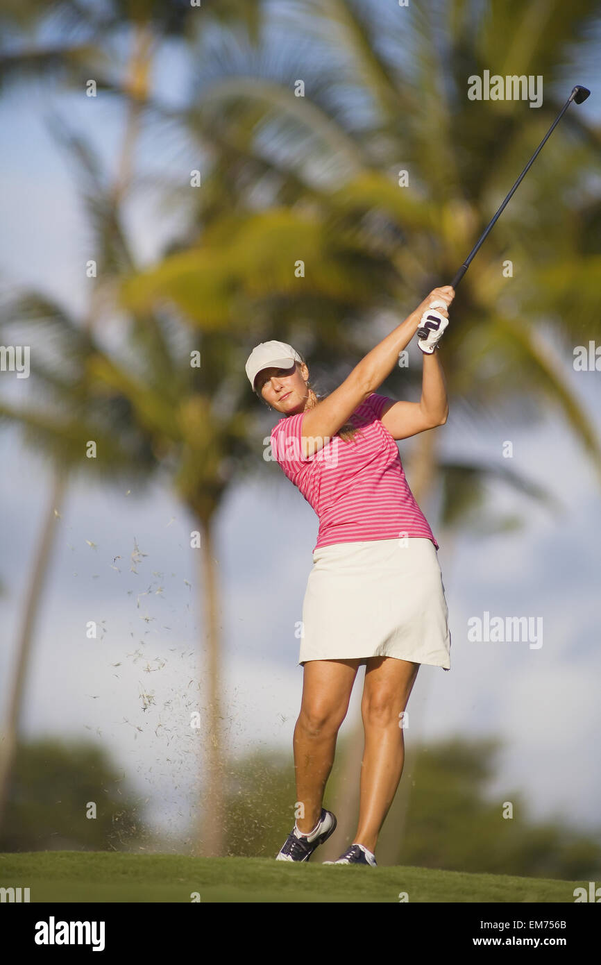 USA, Hawaii Islands, Maui, Turf flying from club; Wailea Gold Golf