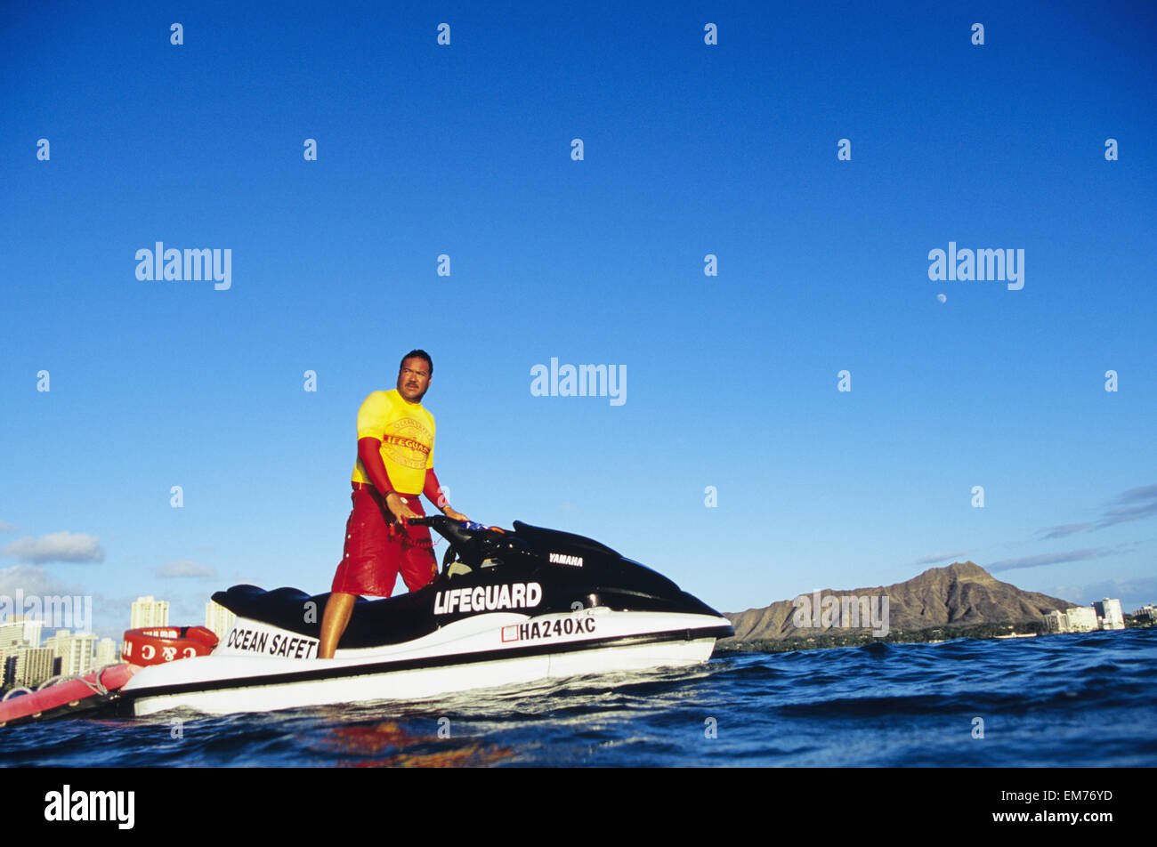 Hawaii, Oahu, Honolulu, Lifeguard On Jet Ski, Diamond Head In Background.  No Model Release Stock Photo - Alamy