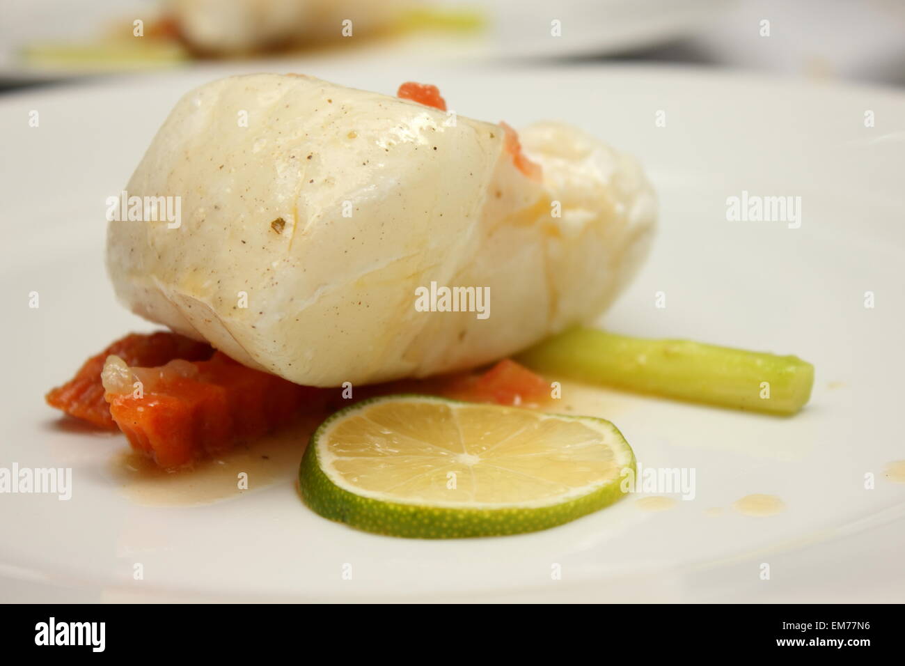 Gourmet Main Entree Course Grilled Snow Fish with white sauce Stock ...