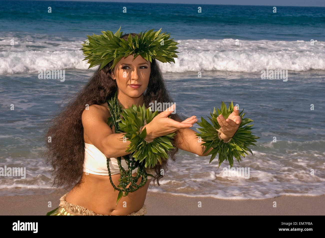 Hula Dancer In TiLeaf Skirt, Haku, Lei, In A Dancing Pose On The Beach