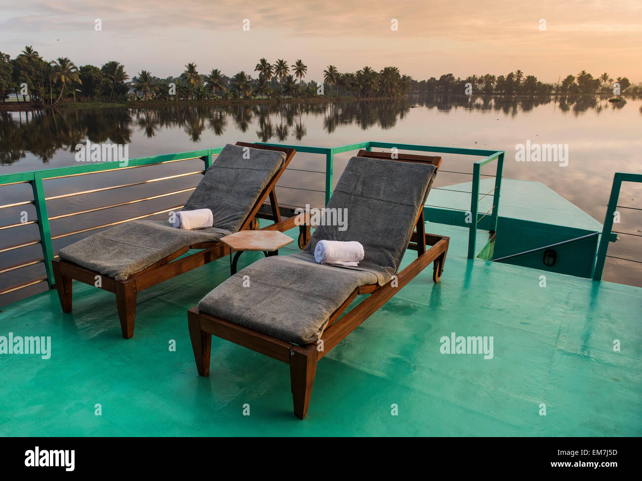 Deck chairs on a deck, luxurious houseboat, Discovery of the boutique hotel chain Malabar Escapes, morning light, backwaters Stock Photo