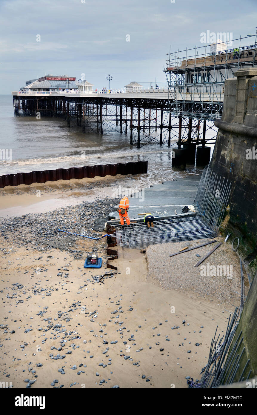 restoration work cromer pier after storm surge in north sea Stock Photo