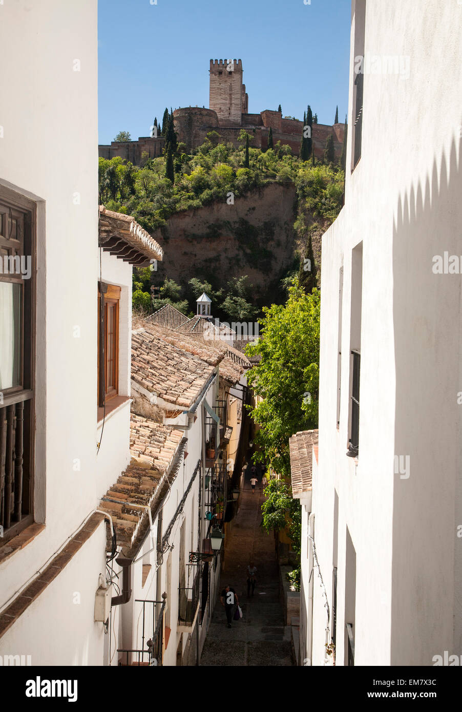 Narrow alleyway named Candil in the Moorish housing district of Albaicin, Granada, Spain with a view to the Alhambra Stock Photo