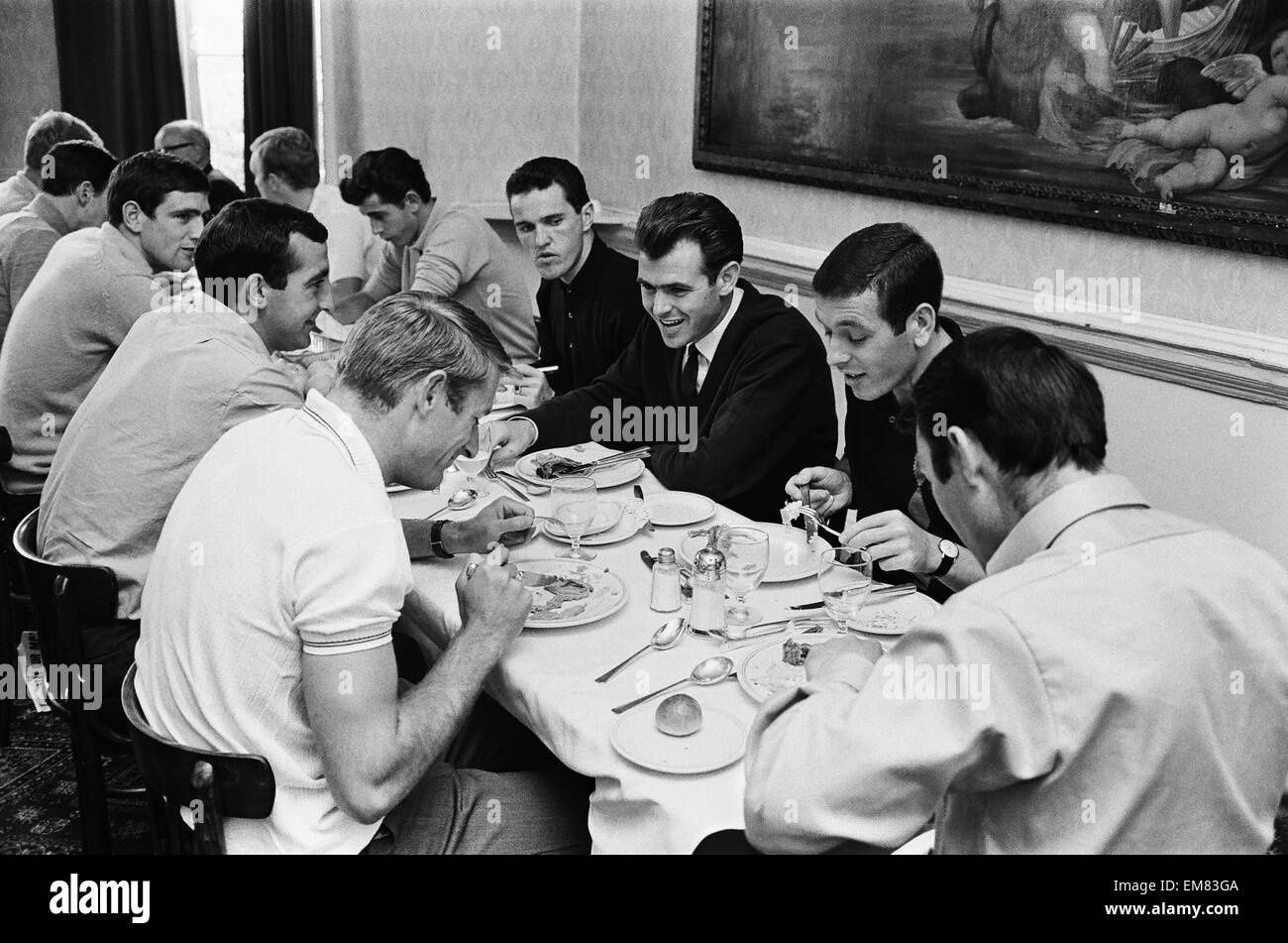 Members of the England football team including Terry Paine, John Connelly, Ian Callaghan, Jimmy Greaves, Roger Hunt and Jimmy Armfield eating breakfast at the team hotel in Hendon during the 1966 World Cup tournament. 10th July 1966. Stock Photo