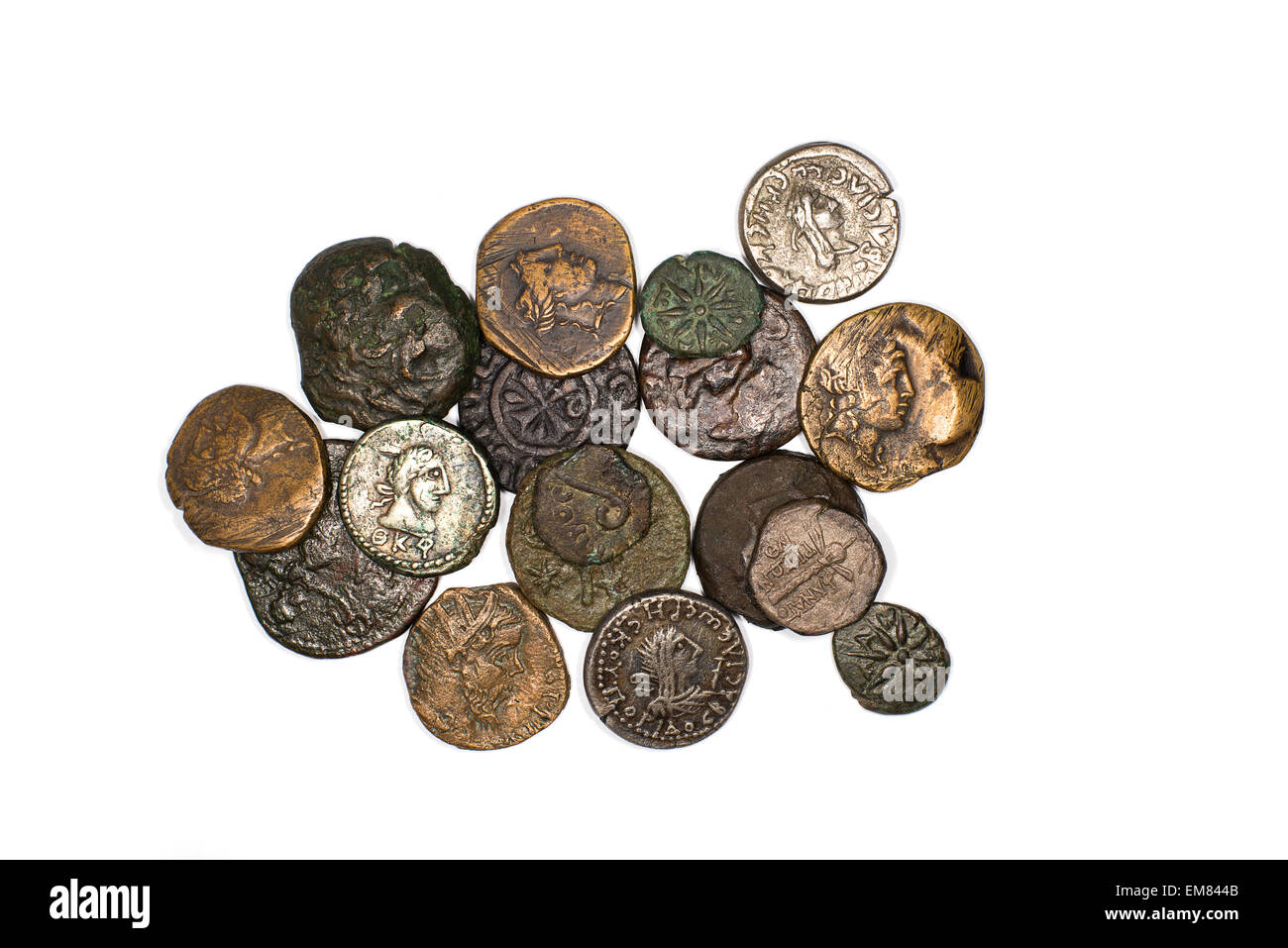 Many ancient bronze and silver coins on a white background Stock Photo