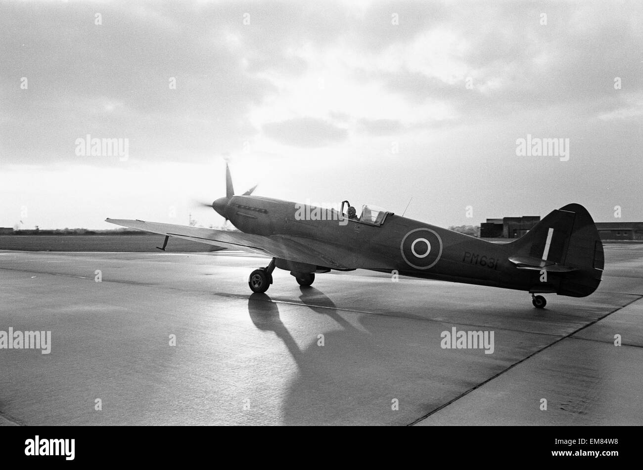 Spitfire PM631 a mk PRXIX aircraft seen here taxi-ing along the perimeter track at RAF Coltishall. The aircraft was preparing to take part in the flypast to commemorate the funeral of Winston Chuchill 26th January 1965 Stock Photo