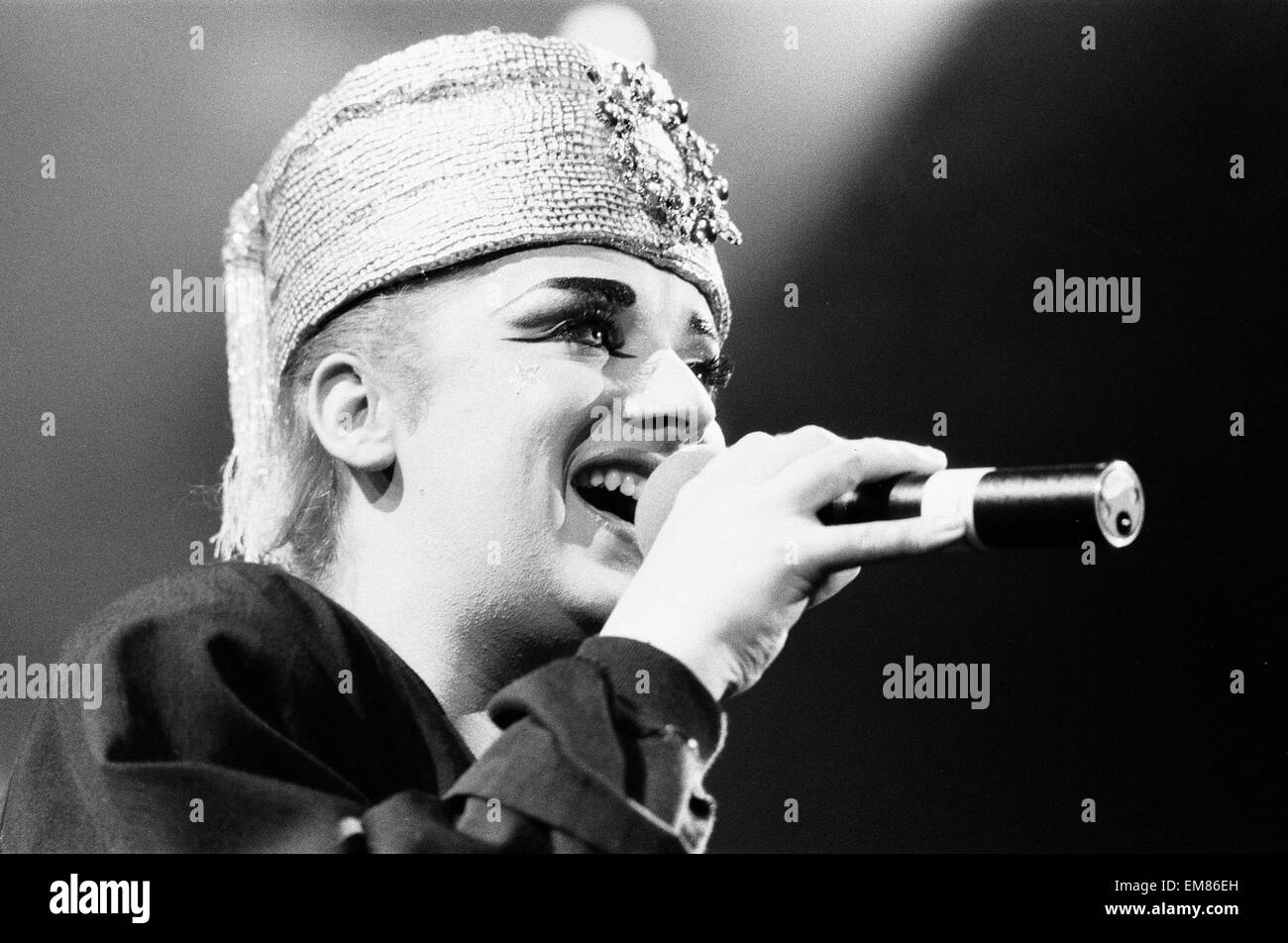 Lead singer with the band Culture Club, Boy George seen here with a 'Boy George' doll back stage at the Rosemont Stadium, Chicago. 11th November 1984 Stock Photo