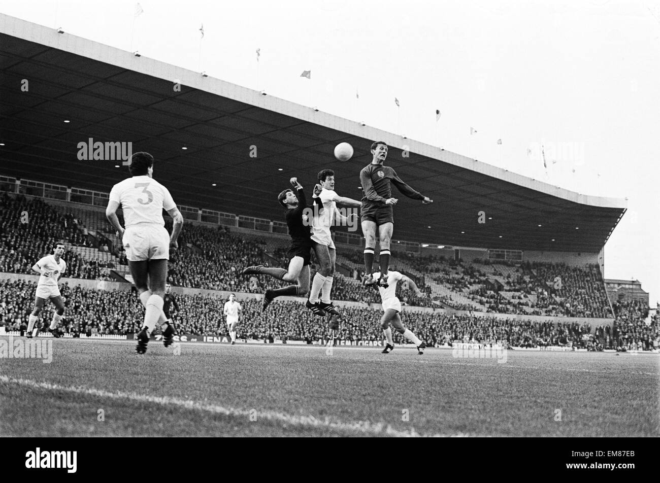 World Cup First Round Group Three match at Old Trafford. Bulgaria 1 v Hungary 3. Bulgaria's number 3 has a shot as Hungarian defenders jump high to stop it. 20th July 1966. Stock Photo