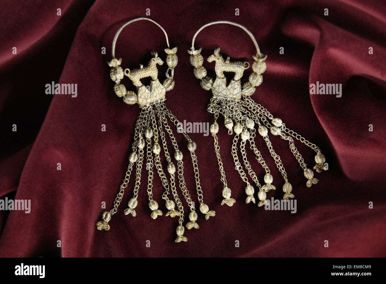 Prague, Czech Republic. 16th April 2015. Pair of Great Moravian silver earrings with long chain pendants and decorated with granulation from the first half of the 10th century from the Princess grave from Stara Kourim displayed at the exhibition 'Great Moravia and the Beginnings of Christianity' in Prague, Czech Republic. The exhibition presenting medieval treasures and original artefacts of the first Slavic state runs in Prague Castle till June 28, 2015. Stock Photo