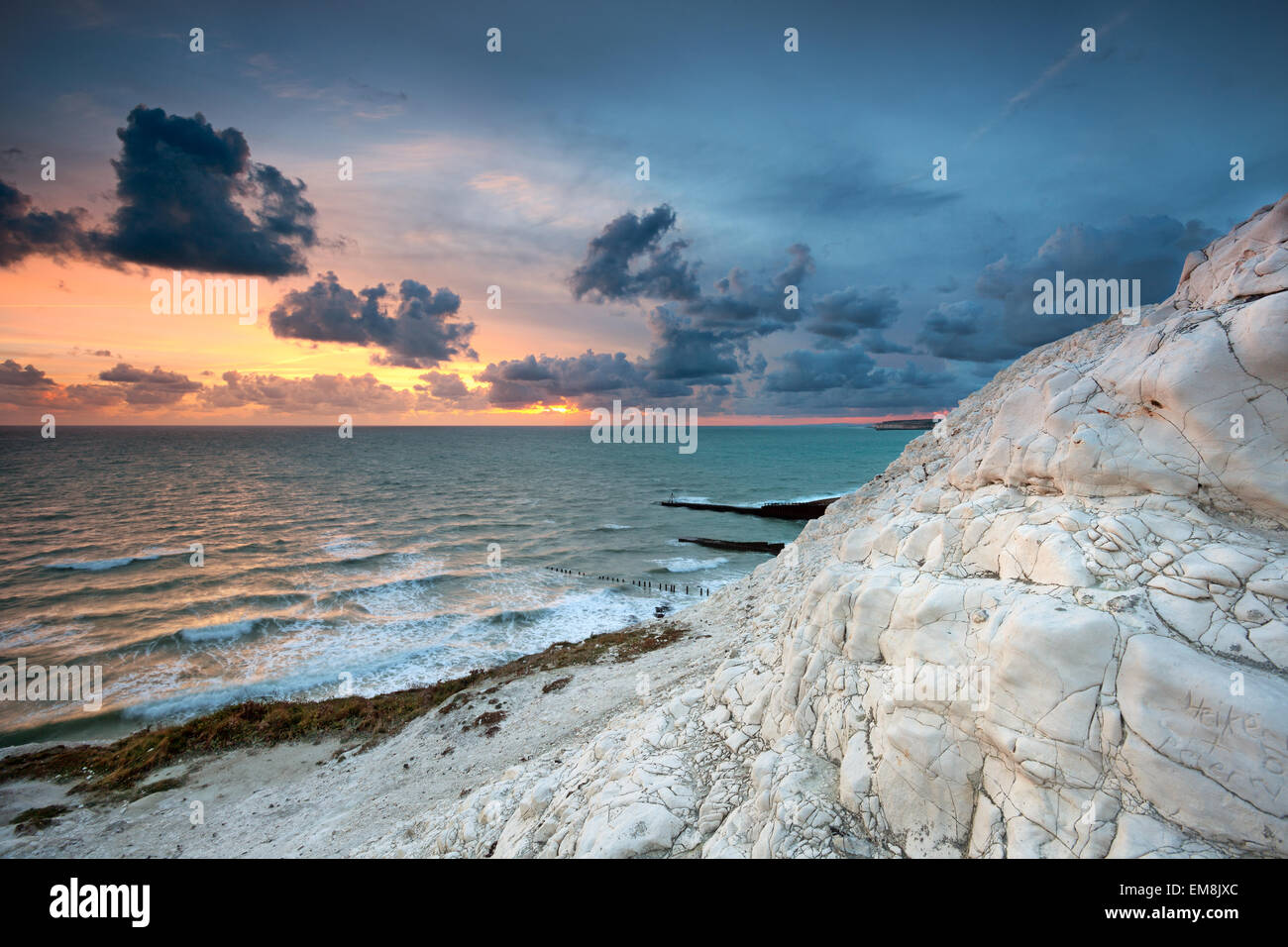 Colorful sunset over the sea at Seaford Head, East Sussex, UK Stock Photo