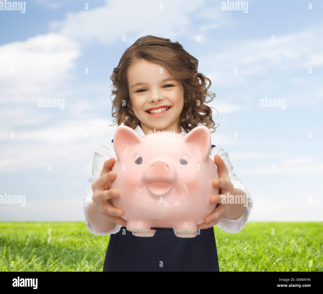 happy girl holding piggy bank Stock Photo - Alamy