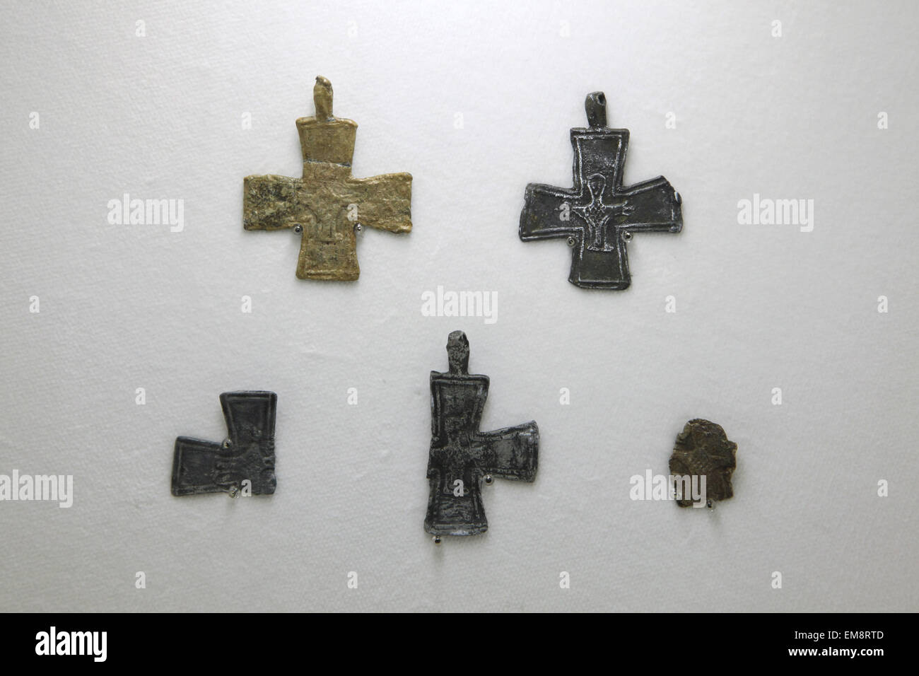 Great Moravian leaden and bronze crosses from the 9th century displayed at the exhibition 'Great Moravia and the Beginnings of Christianity' in Prague, Czech Republic. The crosses were discovered in Pohansko at Breclav and Dolni Vestonice in South Moravia, Czech Republic. The exhibition presenting medieval treasures and original artefacts of the first Slavic state runs in Prague Castle till June 28, 2015. Stock Photo