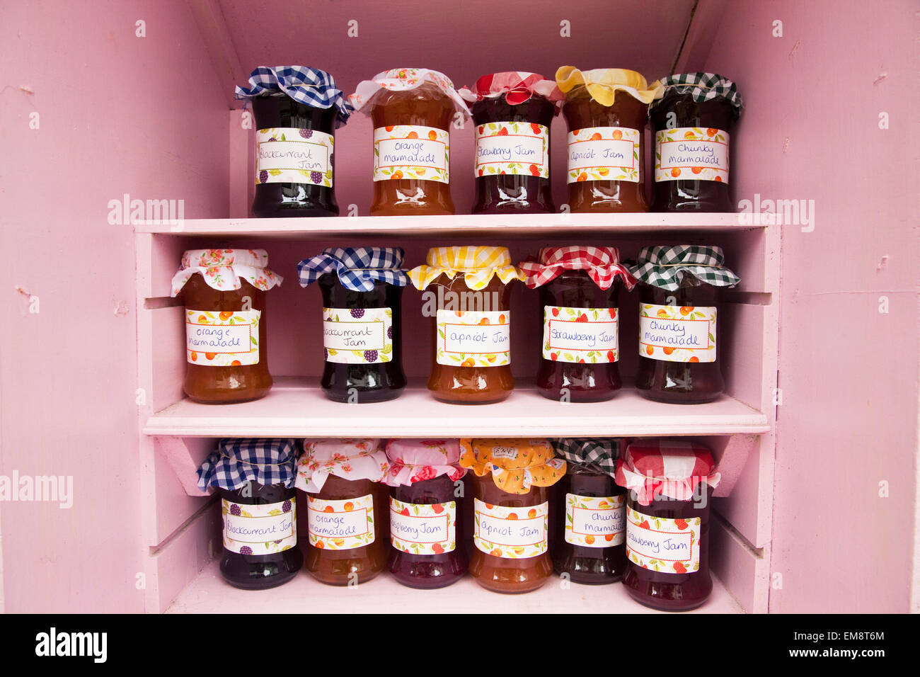 Jars of homemade jam and marmalade on shop shelf Stock Photo