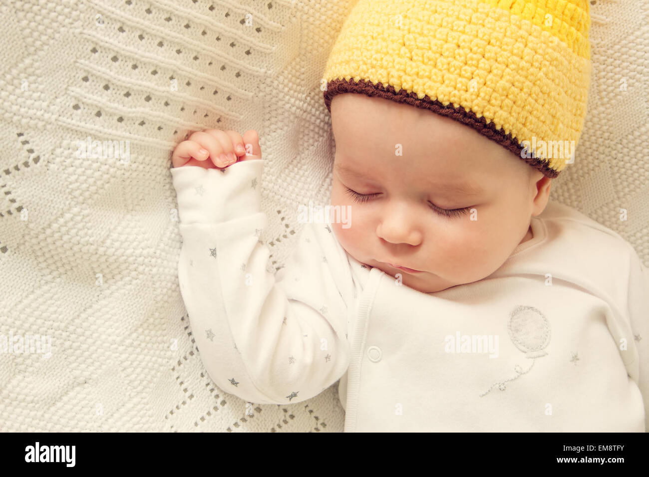 Baby sleeping in giraffe hat Stock Photo Alamy