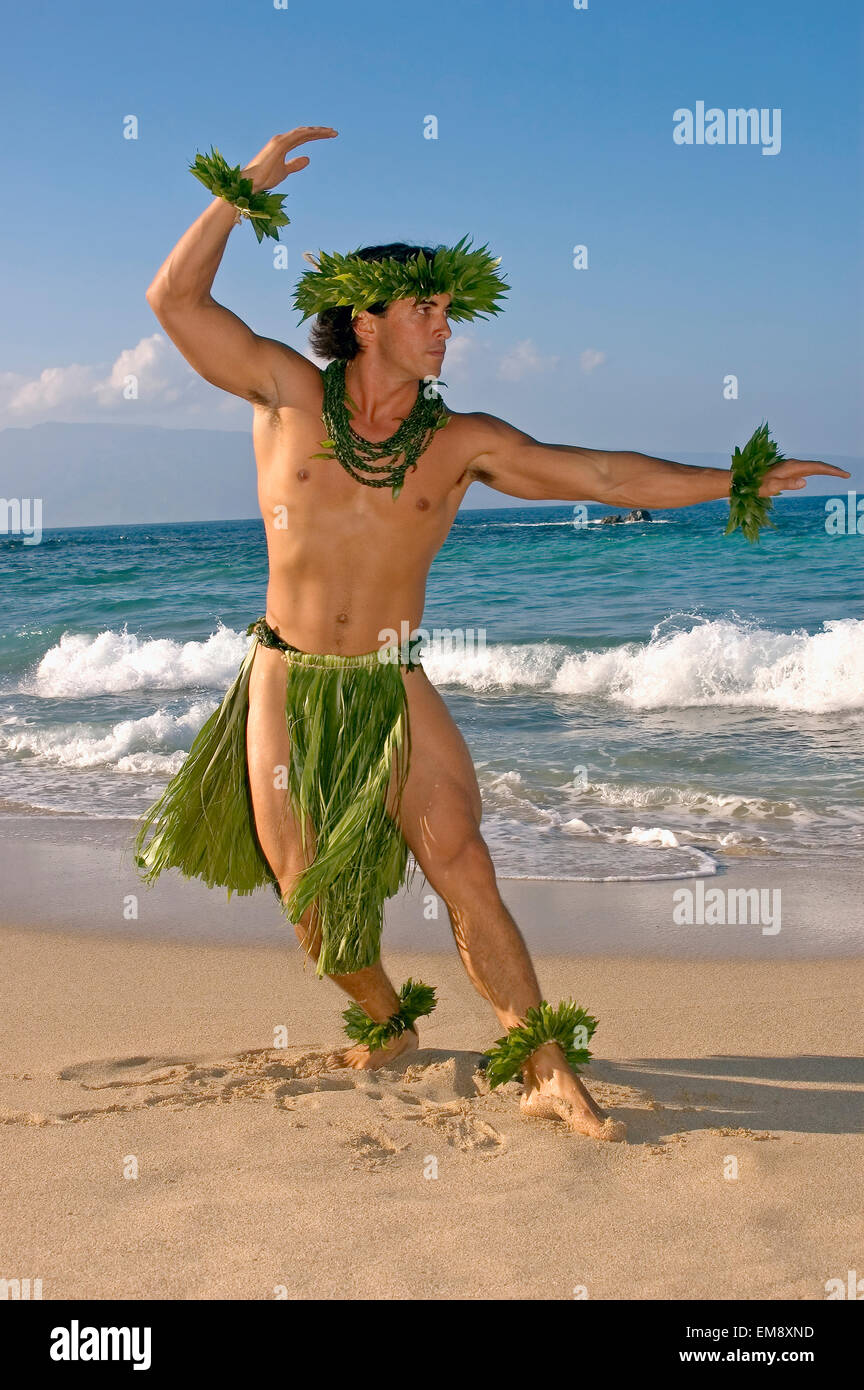 Male Hula Dancer In Ti-Leaf Costume, Haku, Lei, In A Dancing Pose On The Be...