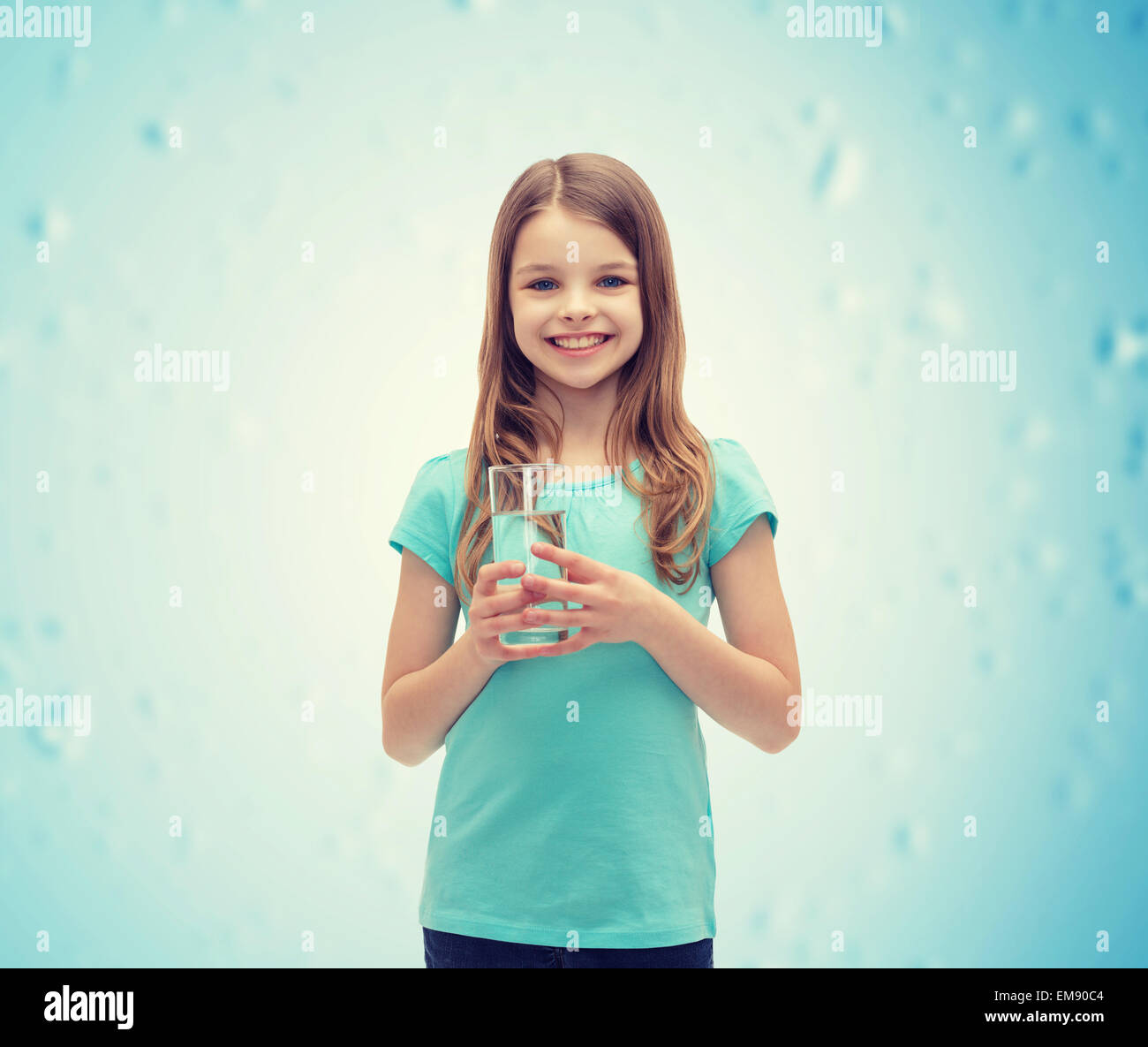 smiling little girl with glass of water Stock Photo - Alamy