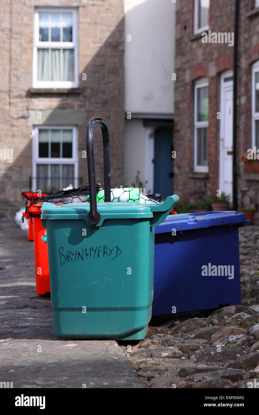 Domestic refuse recycling rubbish bins waiting for collection on dustbin day in Powys Wales