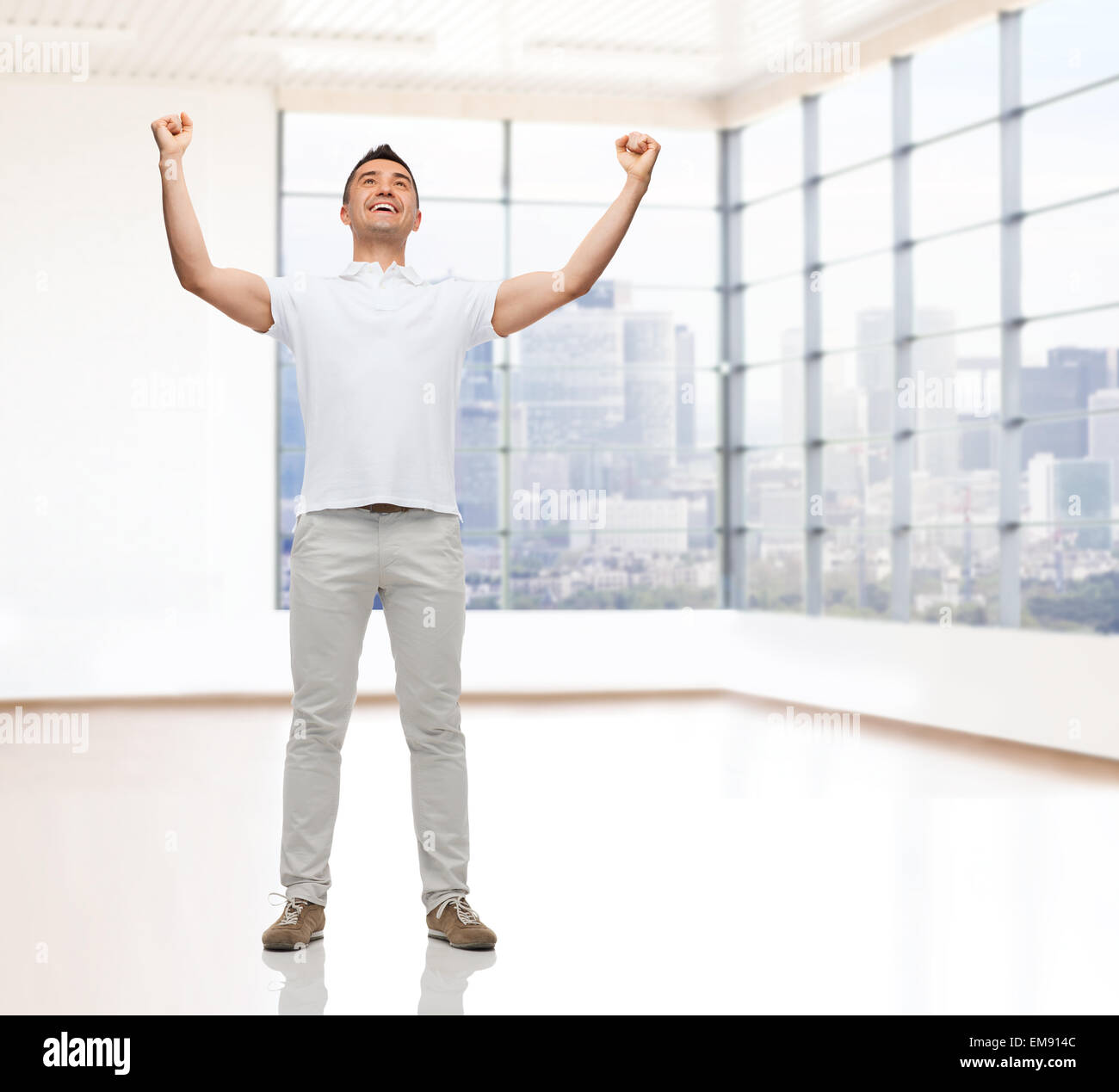 happy man with raised hands Stock Photo Alamy
