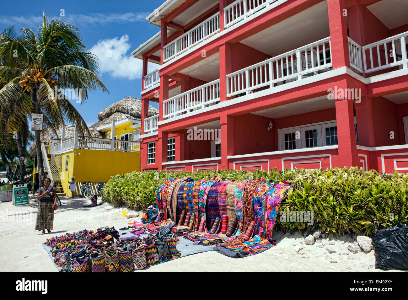 Woman selling hand sewn textiles on the beach of Ambergris Caye, Belize ...