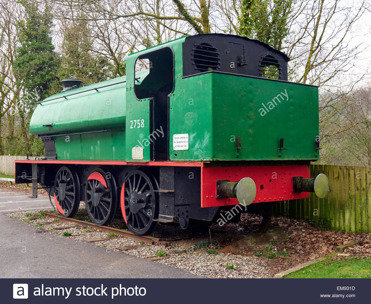 a green and red saddle tank steam locomotive 2758 in crynant colliery car park near neath in south wales