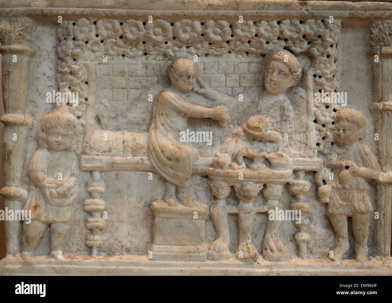 Marble cinerary chest with lid. Roman,ca 90-110 AD. Scene in which the deceased, offering to a female figure, perhaps Tellus. Stock Photo