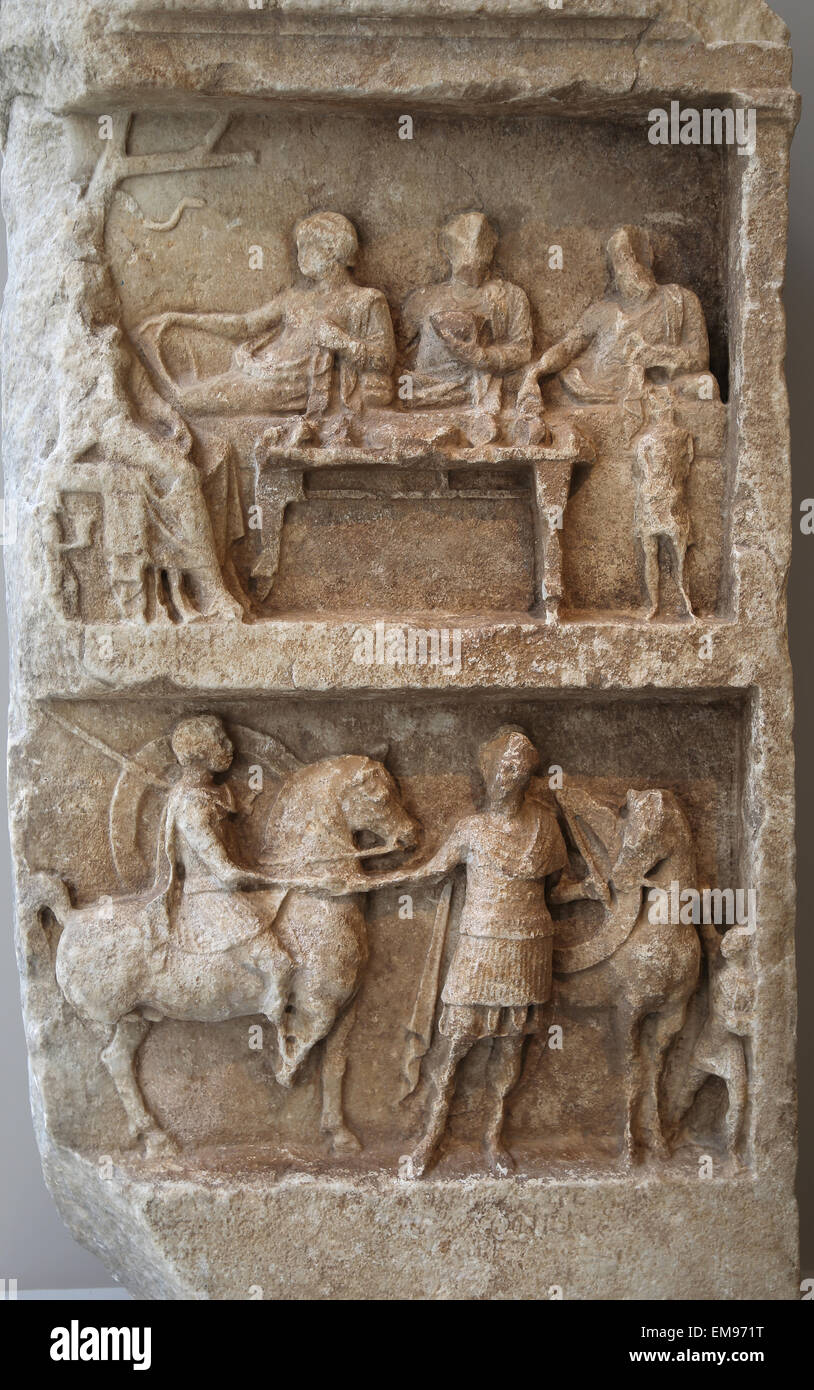 Marble grave relief with a funeray banquet and departing warriors. Greek, Hellenistic period, 2n c. BC. Stock Photo