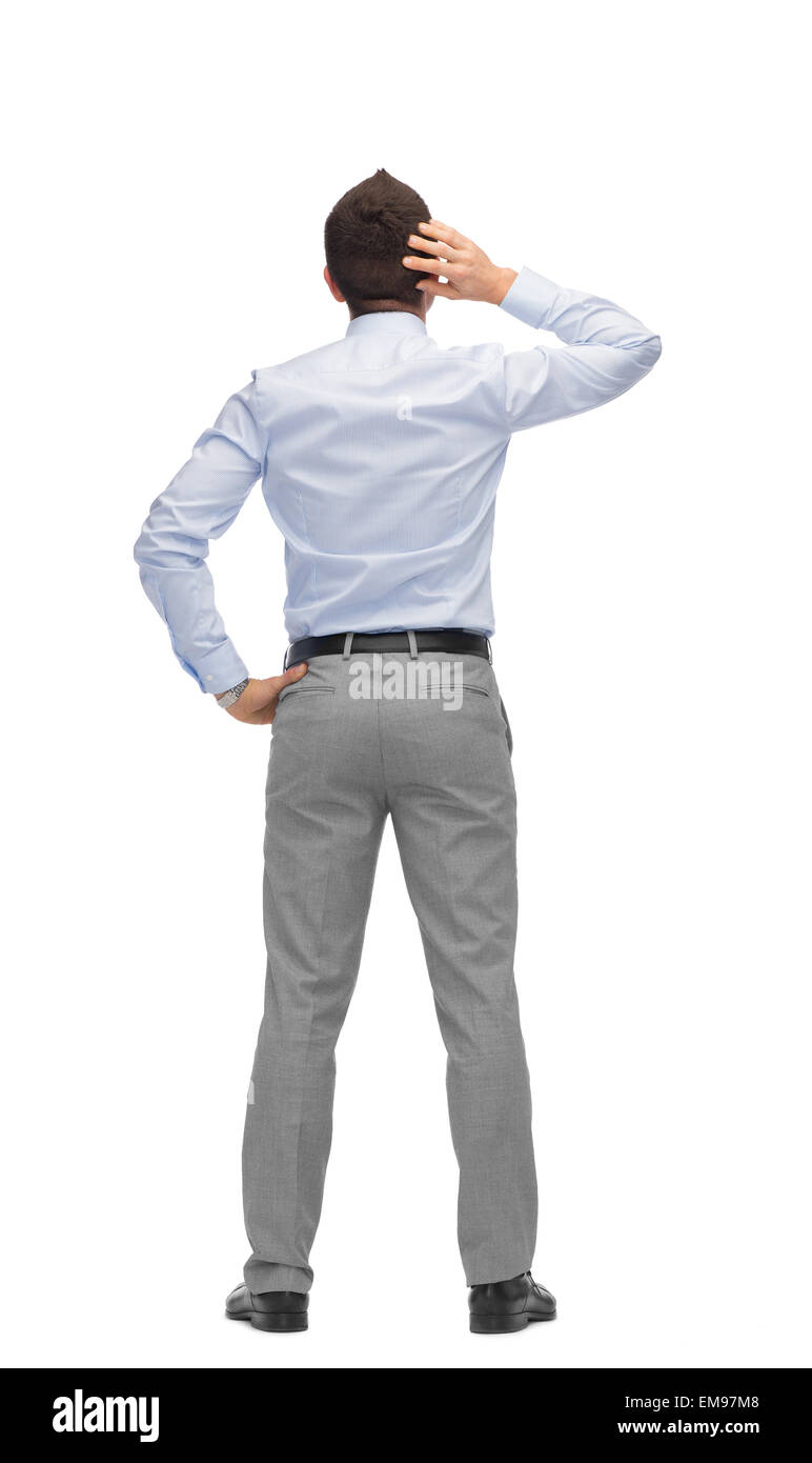 businessman scratching his head from back Stock Photo Alamy