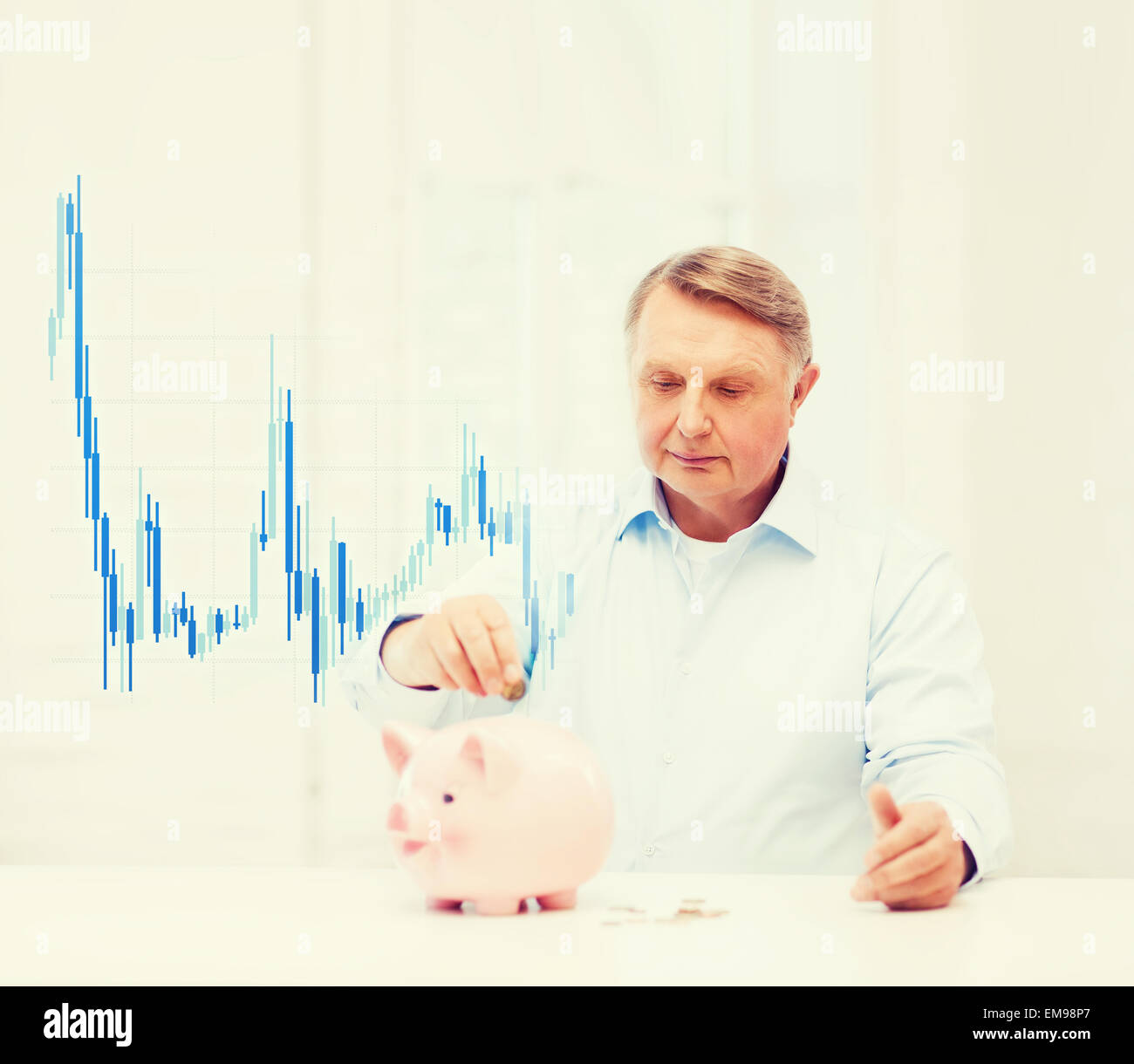 old man putting coin into big piggy bank Stock Photo - Alamy