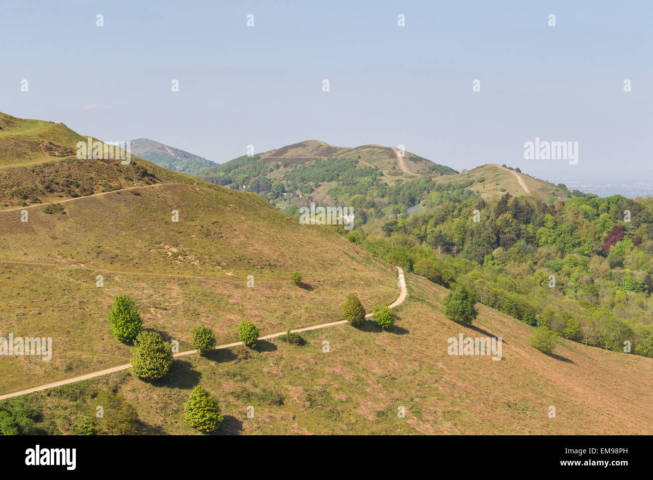 View of contour path leading to British Camp Herefordshire Beacon with Malvern HIlls in background Stock Photo