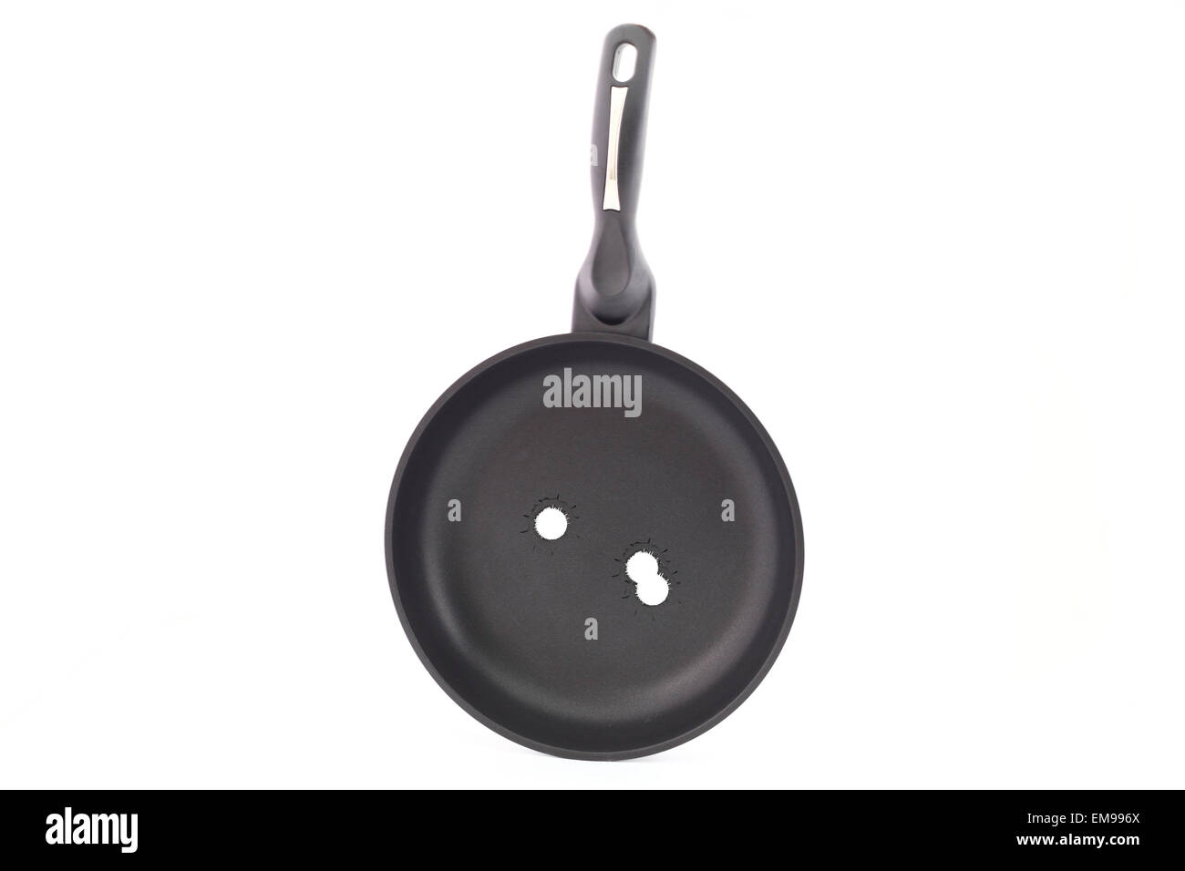 Frying pan on a white background with bullet holes Stock Photo Alamy