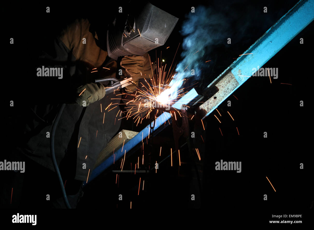 Welding operator welds metal constructions in Kiev, Ukraine. Stock Photo