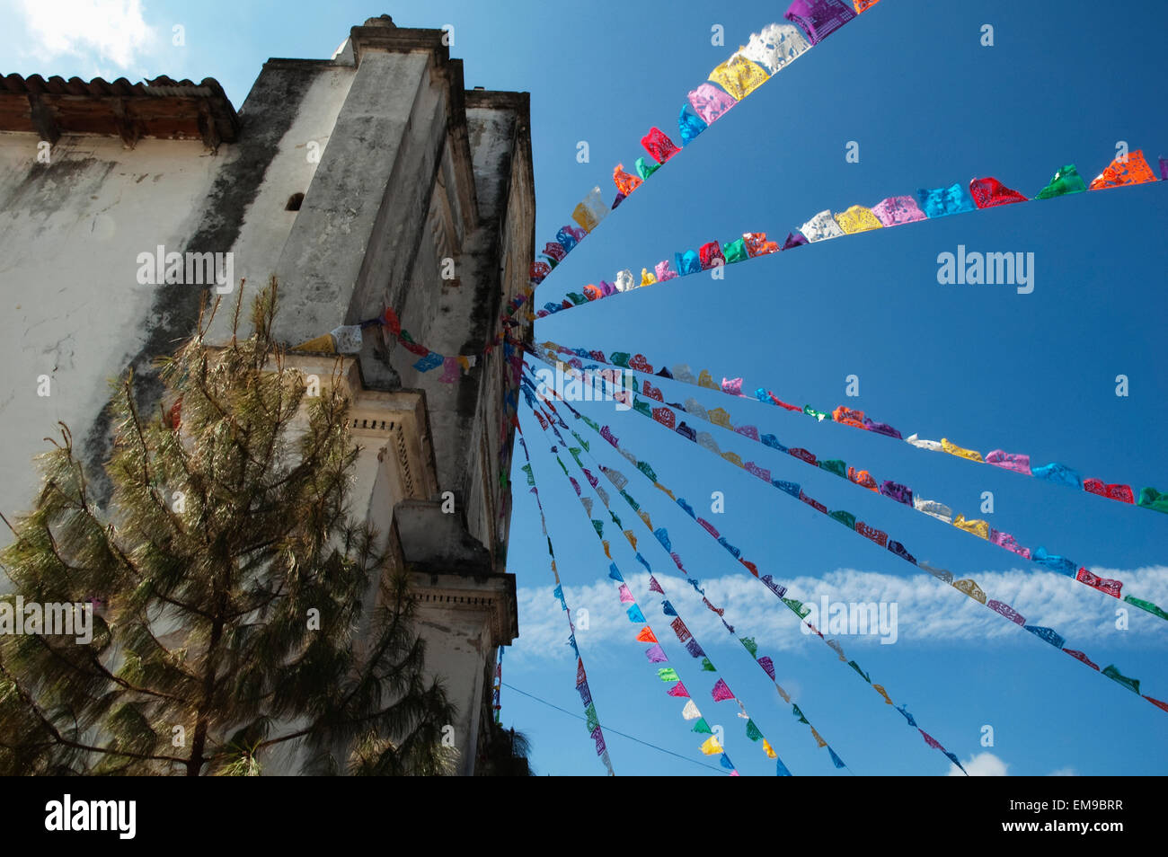 Paper Flags Decorate The Front Of The Church Of San Lorenzo, Zinacantan, Chiapas, Mexico Stock Photo