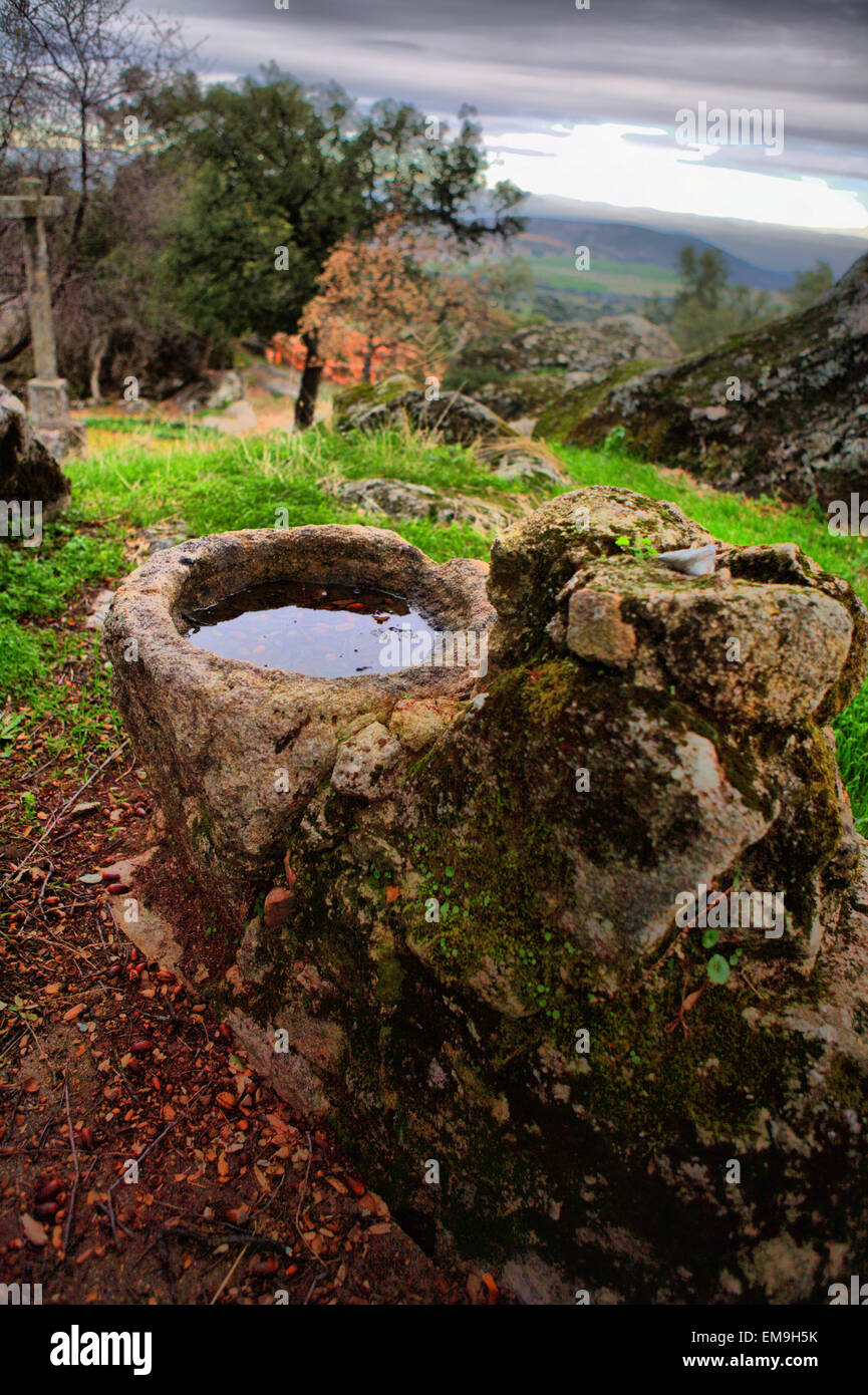 Abandoned granite parapet of a well at Pedroso de Acim village, Caceres, Spain Stock Photo