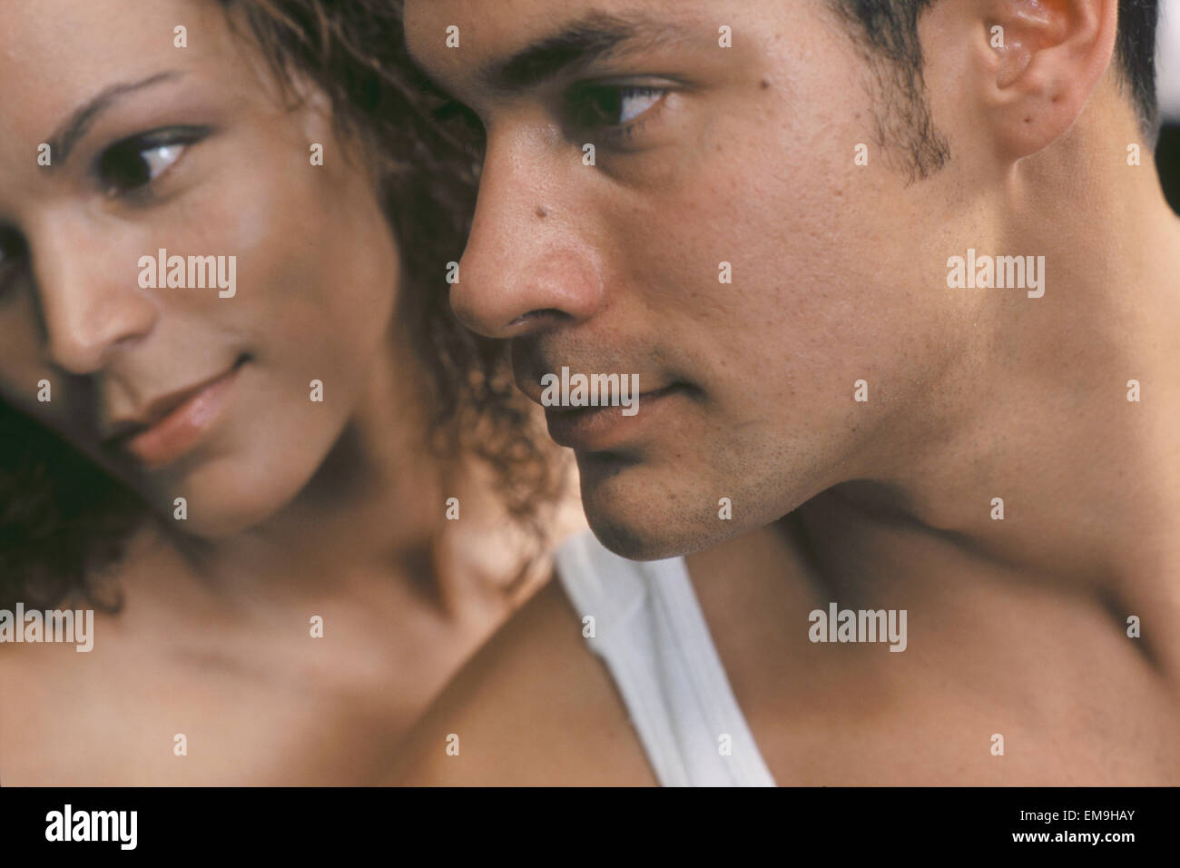 Close up portrait of romantic couple in profile Stock Photo