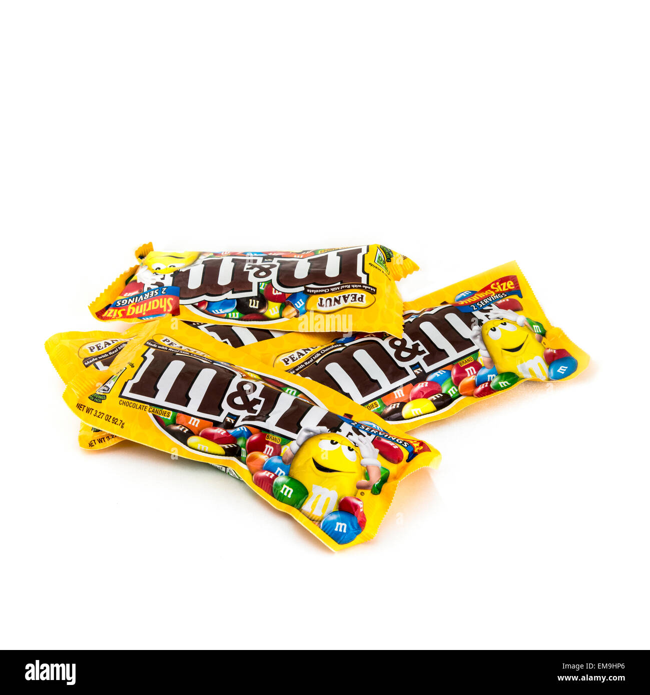 Four M&M chocolate candy packages on a white background. USA. Stock Photo
