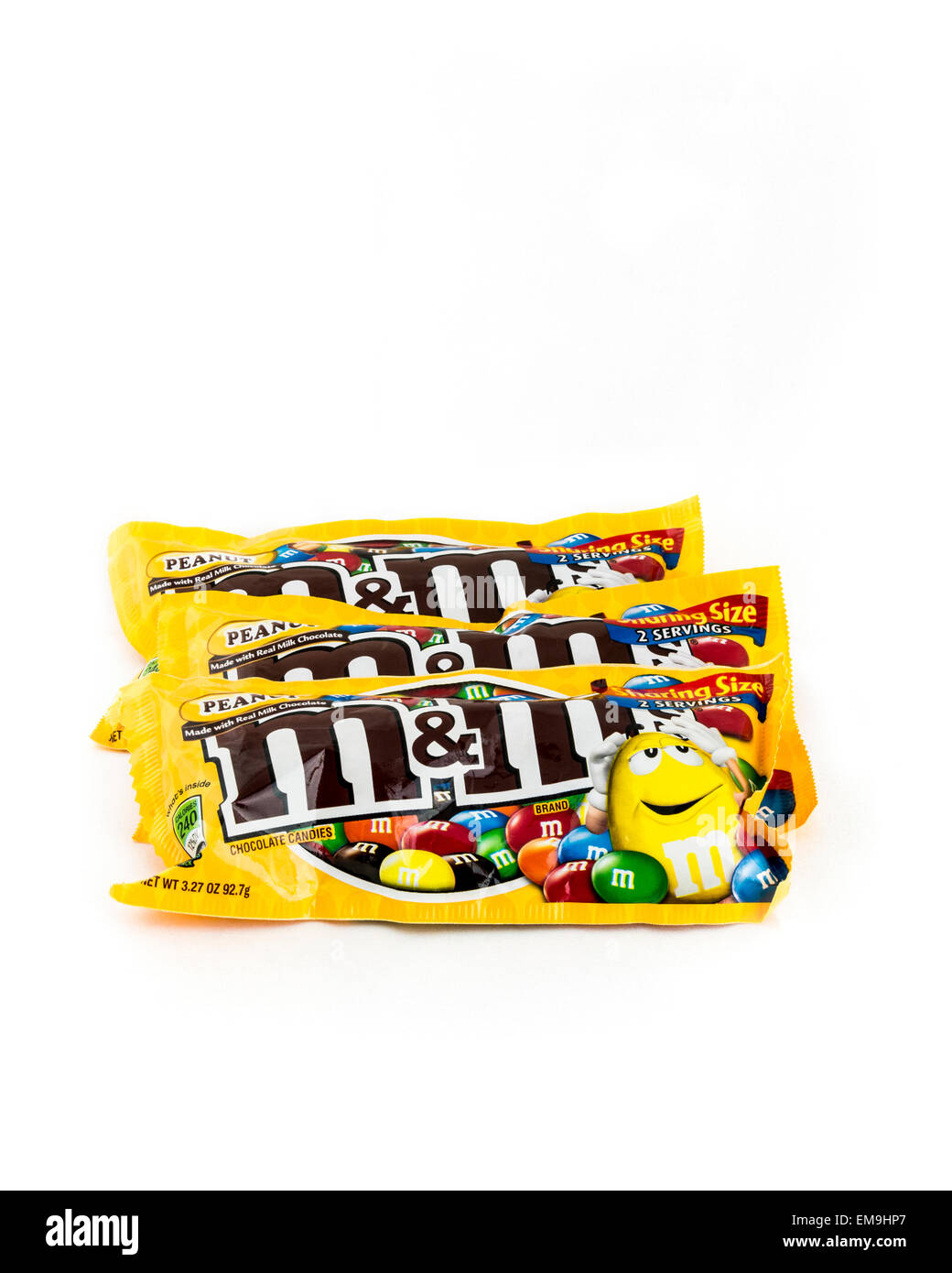 Three M&M chocolate candy packages on a white background. USA. Stock Photo