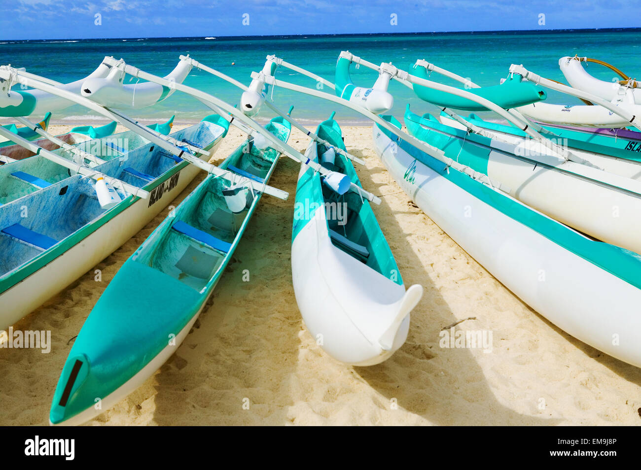 Hawaii, Oahu, Lanikai, Outrigger Canoes Stacked Along The Beach Stock