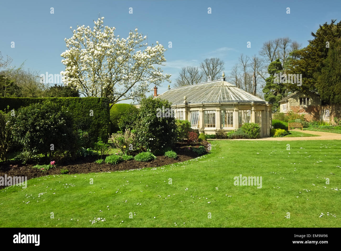 The gardens of Castle Ashby House with a Grade 1 listed greenhouse